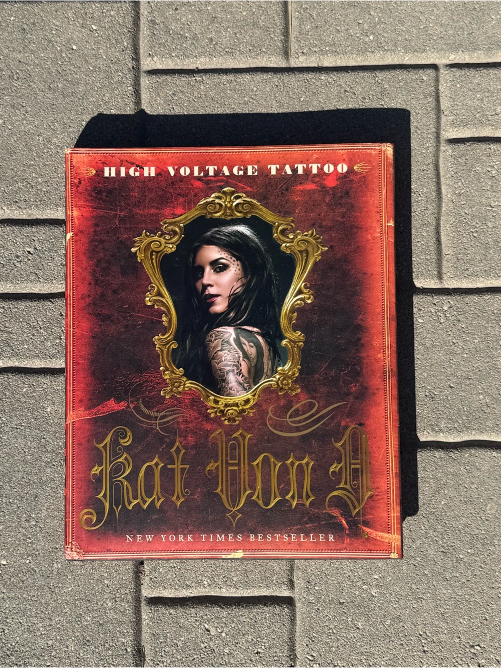 Kat Von D Red and Gold 'High Voltage Tattoo' Art Book Cover